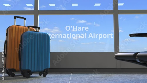 Airliner revealing O'Hare International Airport text in the window of terminal photo