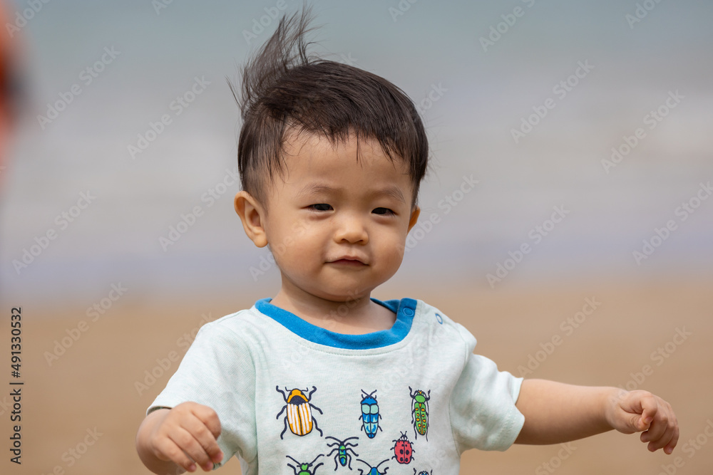 little boy have a good time at the beach little boy have a good time at the beach