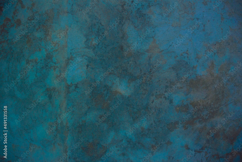 Photo of an old concrete wall tinted turquoise to use as a background