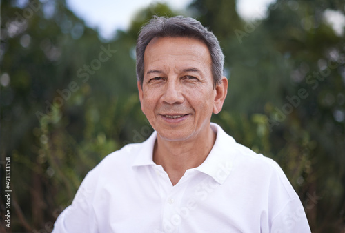 Getting some fresh air. Cropped shot of a handsome mature man standing outdoors.