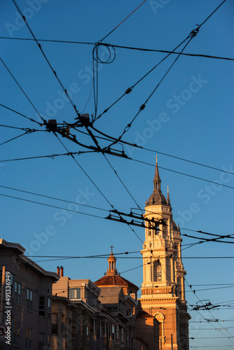 Muni aerial electrical system and Saint Peter and Paul church in the background, San Francisco, California