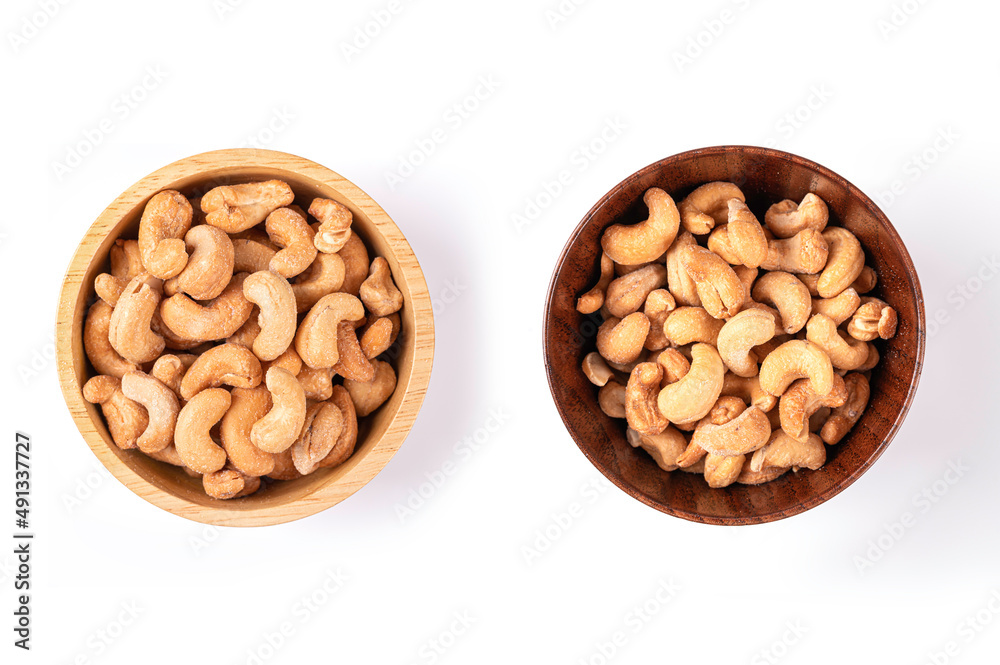 Cashew nuts in wooden bowl isolated. Top view
Cashew nuts in wooden bowl isolated. Top view