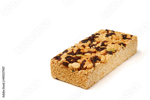 amaranth candy, alegrías typical mexican sweet made with amaranth, seeds, peanuts and raisins on white background with space for text