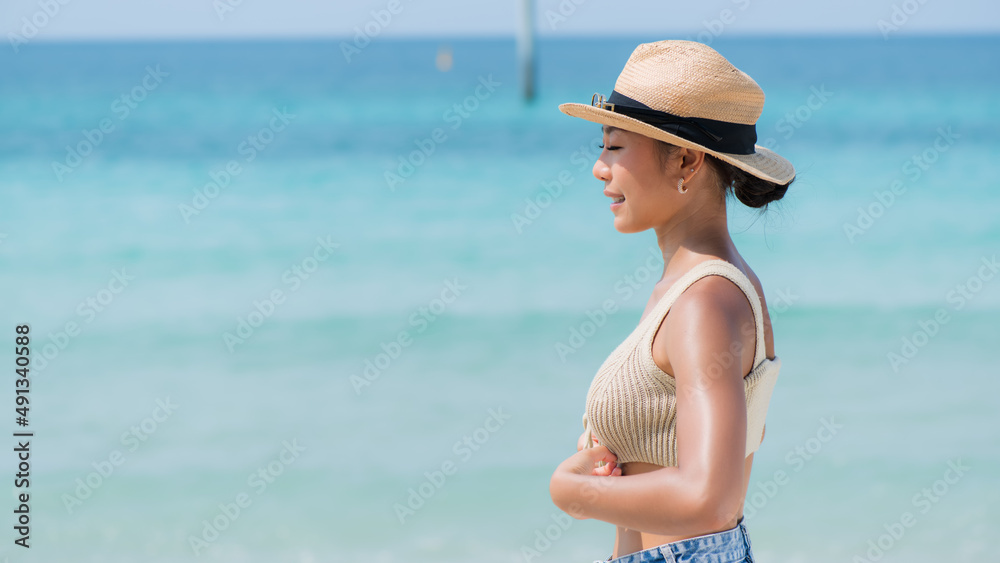 portrait of a person on the beach. Asia woman on the beach and againt sea on background.