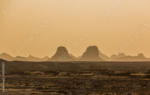 Evening view of the silhouettes of rock formations in the Western Desert  Egypt