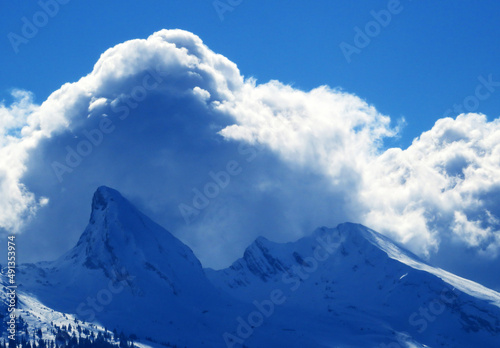 Magical winter clouds over snowy peaks of the Swiss alpine mountain range Churfirsten (Churfürsten or Churfuersten) in the Appenzell Alps massif - Unterwasser, Switzerland (Schweiz)
