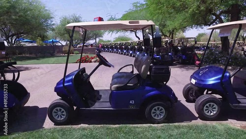 Travel through the opening in a golf cart at the Greyhawk Golf Course, Scottsdale, Arizona. photo