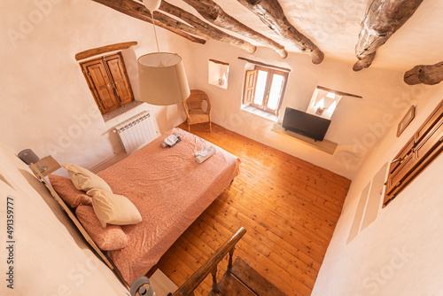 View from above of cozy bedroom of a rural hotel photo