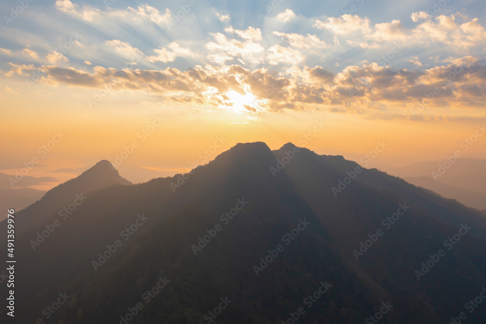Aerial top view of forest trees and green mountain hills with fog, mist and clouds. Nature landscape background, Thailand. Aerial top view of forest trees and green mountain hills with fog, mist and clouds. Nature landscape background, Thailand.