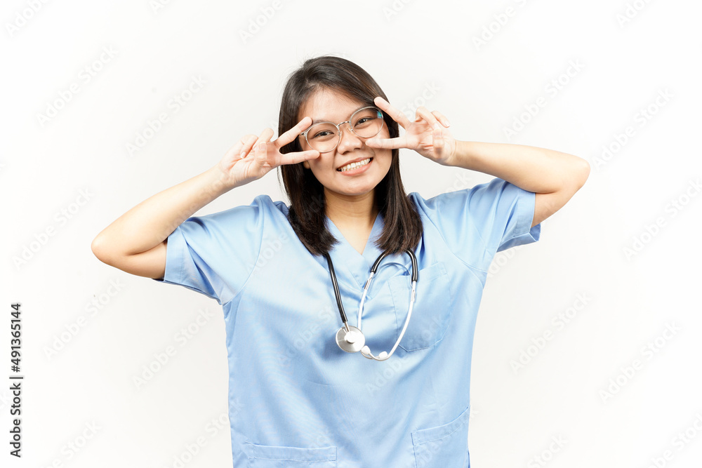 Showing Peace Sign Of Asian Young Doctor Isolated On White Background Showing Peace Sign Of Asian Young Doctor Isolated On White Background