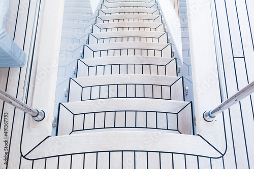 Teak stairs descending on a luxury yacht.