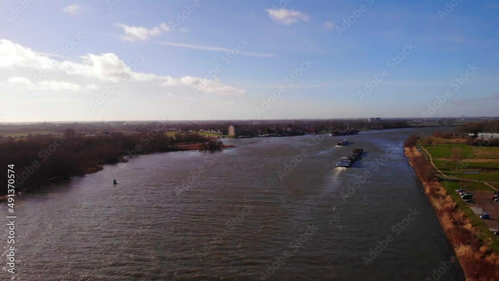 Aerial View Rising Above Oude Maas With Two Boats In The Distance In Zwijndrecht Aerial View Rising Above Oude Maas With Two Boats In The Distance In Zwijndrecht