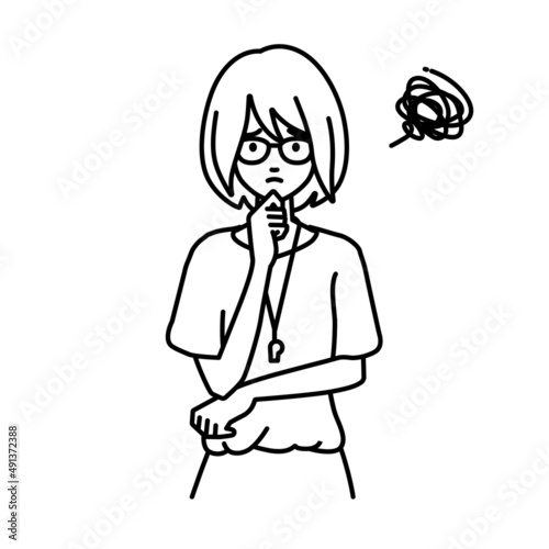 立って手をあごにあてて困っている教師の女性