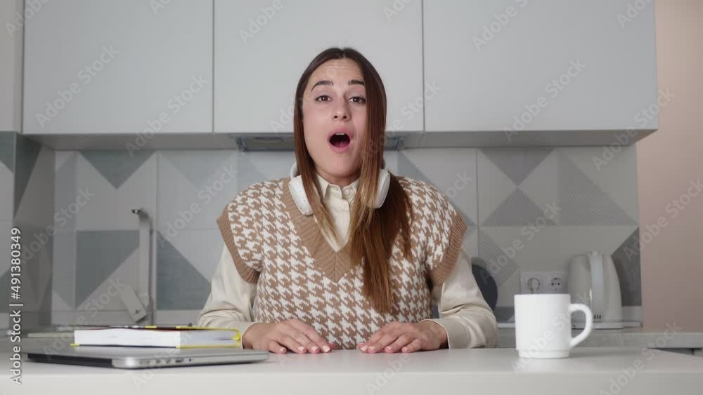 Slow motion of surprised and excited young woman saying wow touching head and looking at camera with joy and excitement. Emotions and good news concept. Slow motion of surprised and excited young woman saying wow touching head and looking at camera with joy and excitement. Emotions and good news concept.