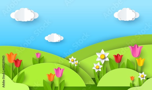 Green grass hills  flowers  blue sky with clouds  vector paper cut illustration. Nature landscape  spring background.