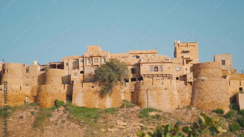 Closeup shot of the fort wall with buildings at Jaisalmer Fort in Jaisalmer, Rajasthan, India. Houses inside the fort wall. Fort in the desert of Jaisalmer.