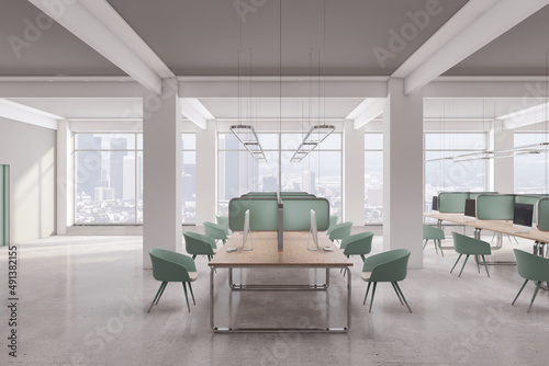 Clean coworking office interior with window and city view, furniture and equipment. Design and workplace concept. 3D Rendering.