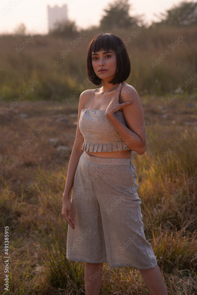 Beautiful Young Fashion model posing outdoor in casual garments Beautiful Young Fashion model posing outdoor in casual garments