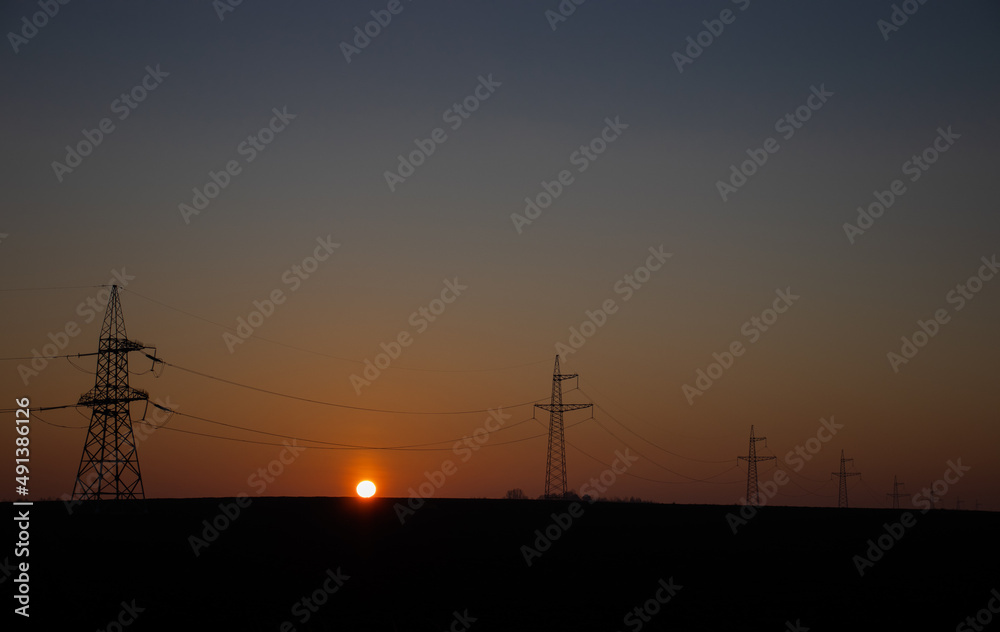 power lines and the rising sun
