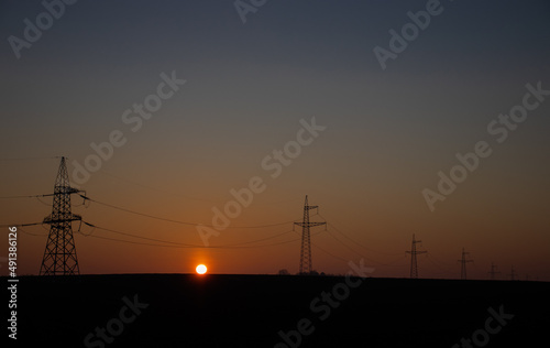 power lines and the rising sun