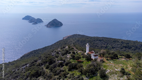 Gelidonya Lighthouse at cape in Mediterranean sea. Lighthouse and three Islands on Lycian Way in. Karaoz, Antalya, TURKEY