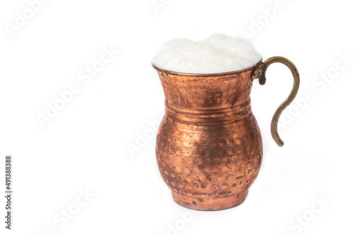 Ayran - Traditional Turkish yoghurt drink in a copper cup photo