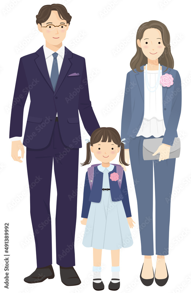 First grade girls and parents standing side by side First grade girls and parents standing side by side