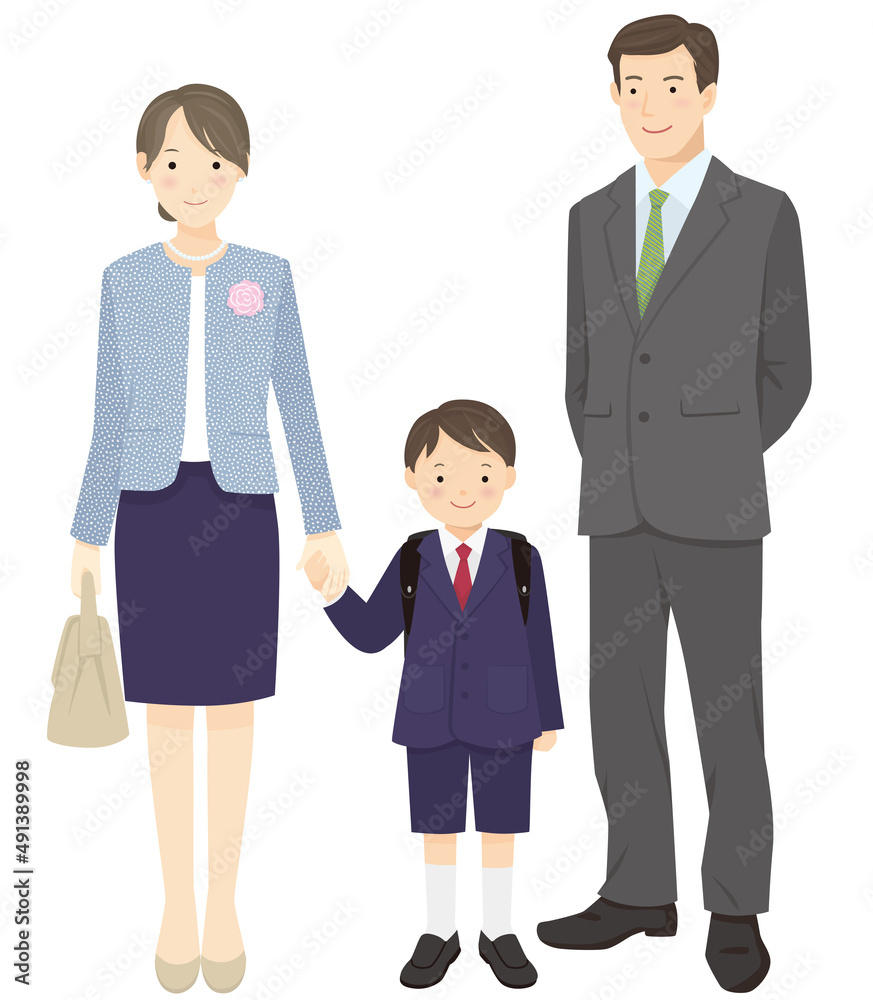 First grade boy and parents standing hand in hand First grade boy and parents standing hand in hand