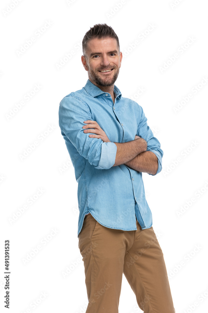 enthusiastic grey haired man with arms folded smiling and being happy enthusiastic grey haired man with arms folded smiling and being happy