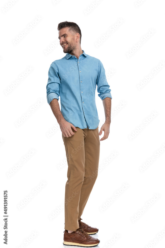 Fototapeta premium happy middle aged man looking behind and smiling