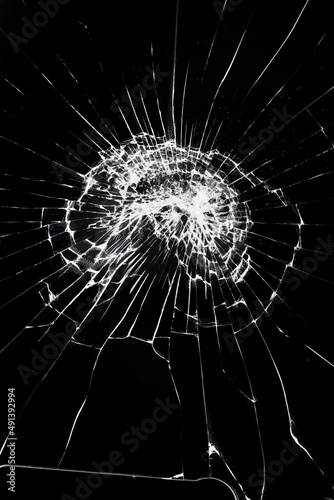 Texture of broken glass with cracks. Abstract cracked smartphone screen from shock.