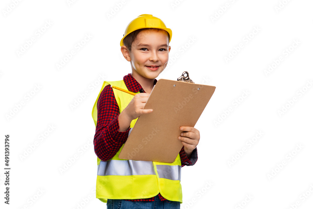 building, construction and profession concept - little boy in protective helmet and safety vest with clipboard and pencil over white background building, construction and profession concept - little boy in protective helmet and safety vest with clipboard and pencil over white background