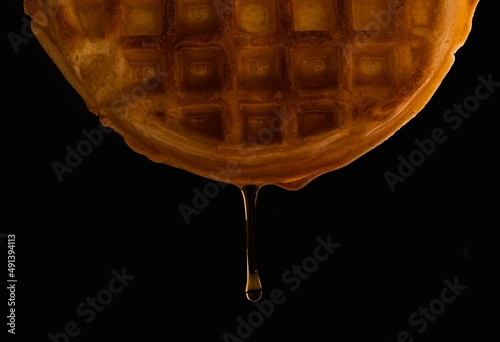 Syrup dripping from waffle