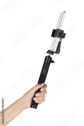 Hand holding Selfie stick mobile isolated on white background