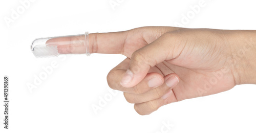 Картината върху платно fingers with Silicone brush for cleaning the teeth of babies isolated on white b