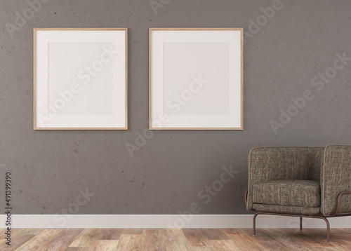 Empty room with a picture frame. two blank canvases, for a living room. Front view.Decorated with an armchair on the right side of the scene. light parquet © Javier