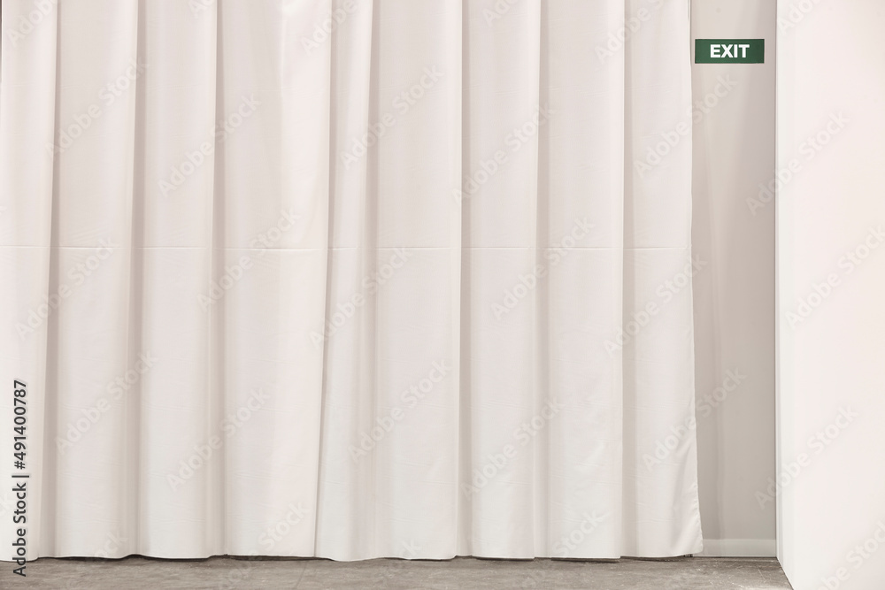 Exit sign on a white wall. Information guidance. Interior architecture Exit sign on a white wall. Information guidance. Interior architecture