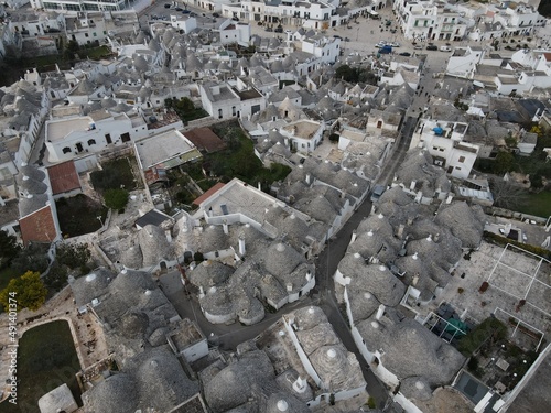 Aerial view of Alberobello, city of Trulli in Itria Valley, Puglia. Traditional Apulian dry stone huts with a conical roof in the Murge area of the Italian region of Apulia. Trulli city in south Italy