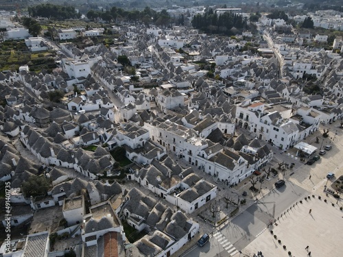 Aerial view of Alberobello, city of Trulli in Itria Valley, Puglia. Traditional Apulian dry stone huts with a conical roof in the Murge area of the Italian region of Apulia. Trulli city in south Italy