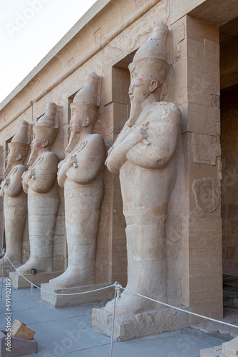 Hatshepsut statues by the columns on the highest terrace of the Mortuary Temple of Hatshepsut, Luxor, Egypt