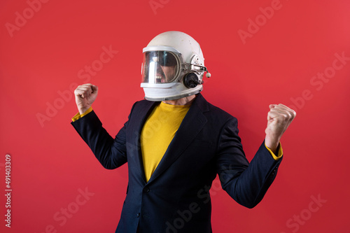 Принти на полотні Businessman with astronaut helmet celebrating elated fists