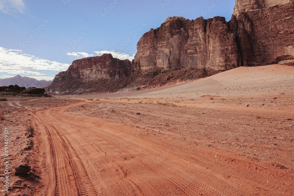 empty winding road in the wadi Rum desert beautiful relief mountains around, nature of Jordan