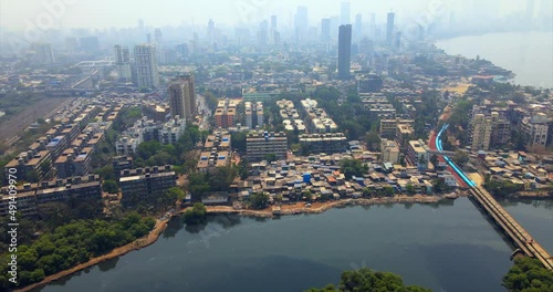 bandra kurla warli  bkc road flyover sealink western express highway india mumbai drone birds eye view cityscape mithi river . photo