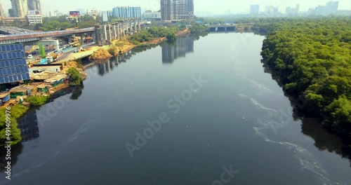 poluted river mithi india mumbai bandra kurla worli vile parle drone shot  Dharavi Creek Bridge photo