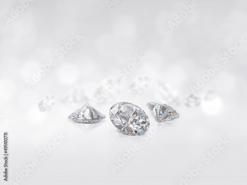 still with expensive cut diamonds in front of a white background, reflections on the ground. Lot of copy space