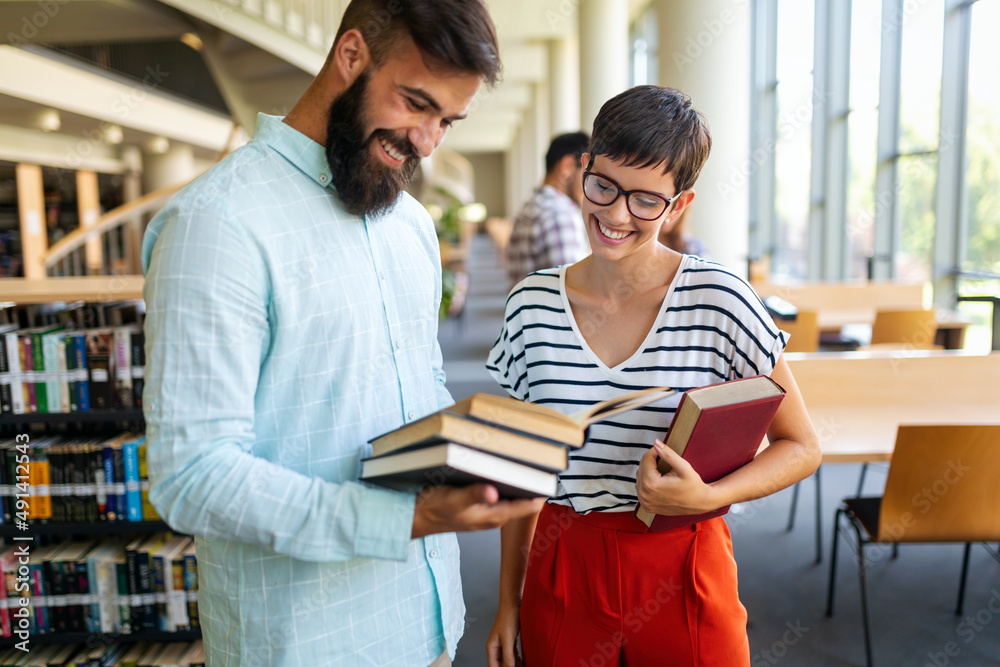 Education friendship people concept. Group of happy students learning together in college library Education friendship people concept. Group of happy students learning together in college library