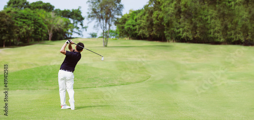 Man playing golf on a golf course panorama banner background