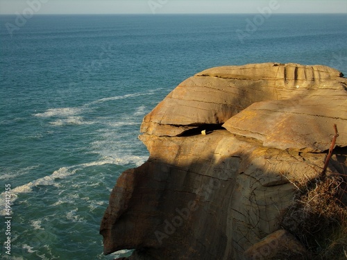 Obraz na plátně Rock on the cliffs of the Atlantic Ocean with the shape of the head of a Starwarrior profile