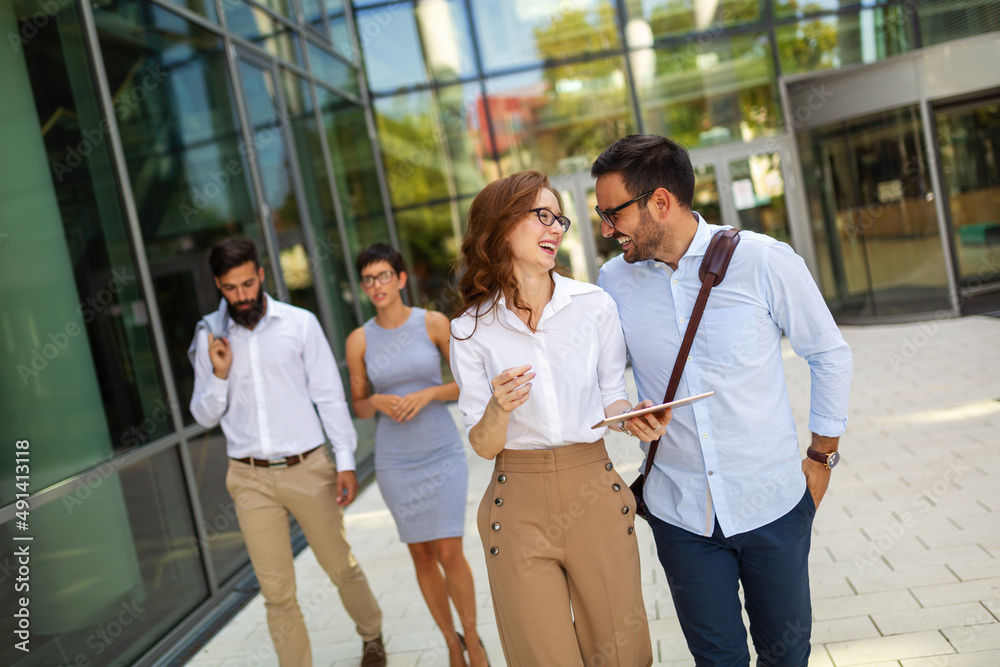Business people having fun, teamwork and chatting at workplace office together. Business people having fun, teamwork and chatting at workplace office together.