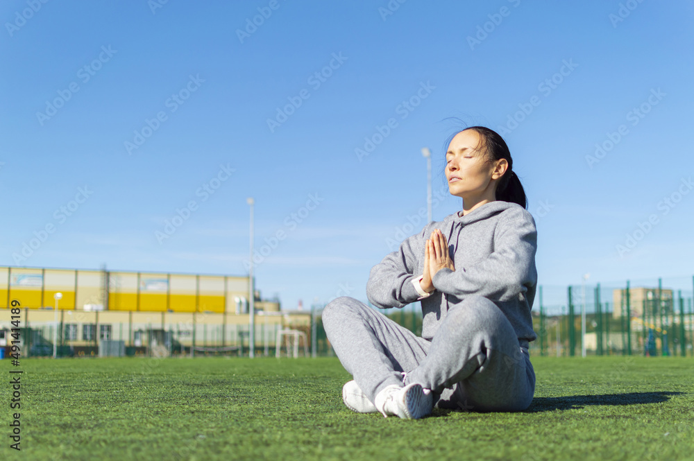 Photo of a woman during yoga practice. Meditation. Photo of a woman during yoga practice. Meditation.